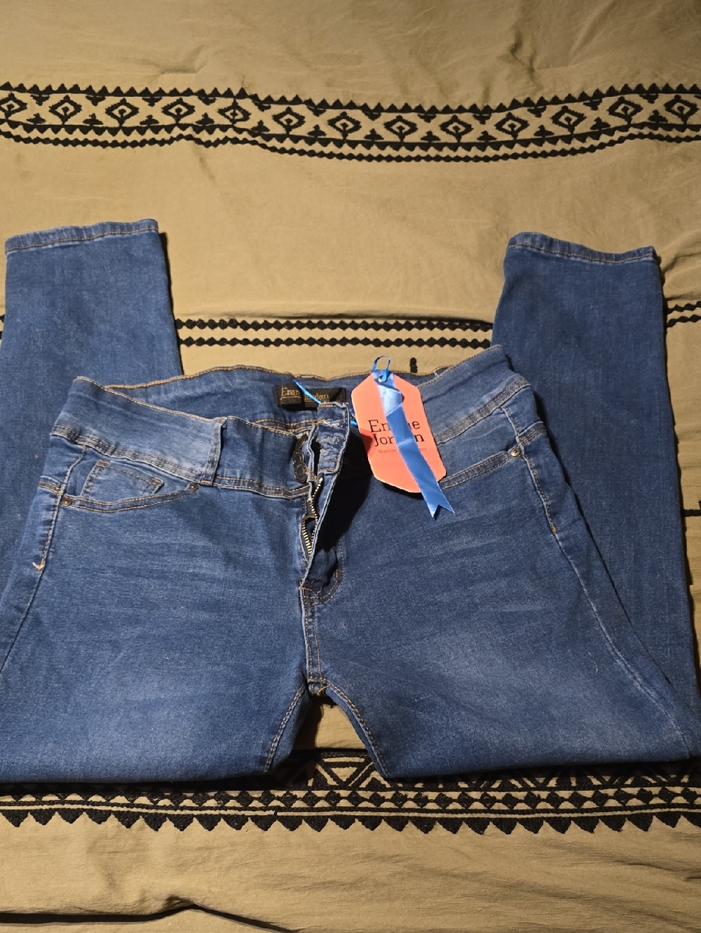 Jordan Pink Tag with Blue Ribbon on Dark Denim